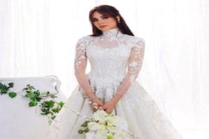 آمال ماهر تكشف سر فستان الزفاف 